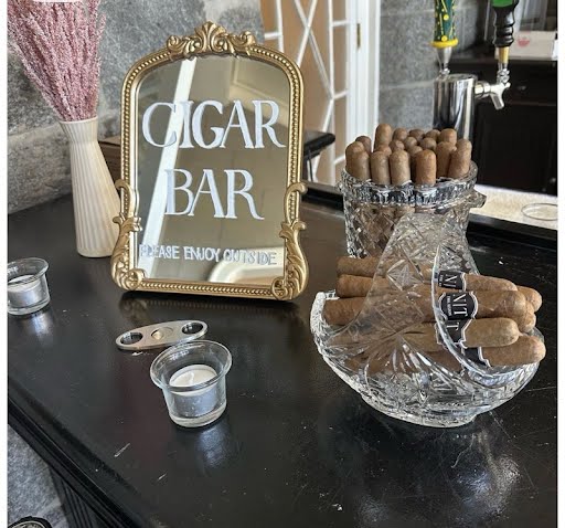 Upscale cigar bar setup for a wedding cocktail hour